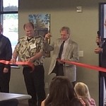 Randy Girard (3rd from right) cuts the Ribbon at the ALL NEW Marquette Township Offices on Commerce Drive!