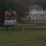 The scoreboard reads the Negaunee Miners WIN 51-0 over the Inland Lakes Bulldogs on Sunny.FM
