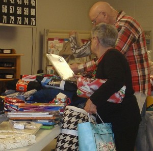 The Veterans dig in to all of the items and select presents for themselves.