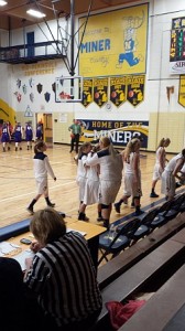 The team gave Courtney Finnila a hug or two after she put in the winning free throws for the Miner girls against L'Anse. 