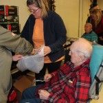 Veterans at the DJ Jacobetti Home for Veterans pick out gifts at the Christmas is for Veterans celebration
