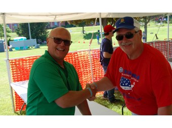 Todd Noordyk Shakes Hand with Geno Angeli of the Marquette County Exchange Club