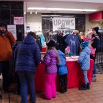 People were checking out the UPAWS Apparel store.