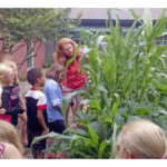 Woodland Childcare Students and Advanced Extension Master Gardener Elizabeth Slajus. Photo credit – Rebecca Krans