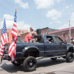 An all around symbol of America - Big trucks and American Flags.