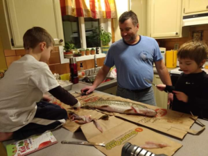 Holden and Titan Learning How to Fillet A Fish with Their Papa Kenny