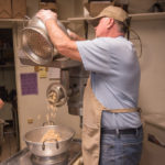 John working in the back making some fresh pasty ingredients.
