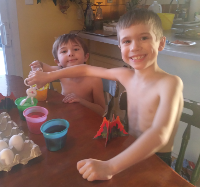 Titan and Holden coloring Easter eggs, April 2019