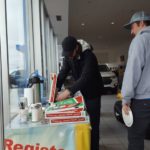 Customers enjoying the free Jet's Pizza