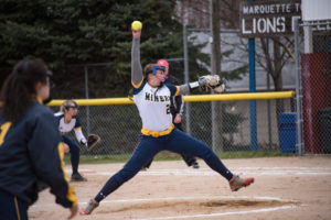 Negaunee Miners Varsity Pitcher Skylar Hall throwing against the Marquette Redettes.