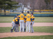 The Negaunee Miners Host Baseball District Championships Saturday and Face the Superior Central Cougars in District Semi-Finals The Negaunee Miners take a break on the pitchers mound to regroup.