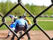 Negaunee Miners Are District Semifinal Champs with 4-3 Win Over Superior Central in Extra Innings Negaunee winds up for a swing at a Superior Central pitch.