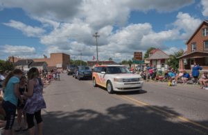 Hey that's us! We're in the Pioneer Days Parade each year as the voice of the Negaunee Miners!