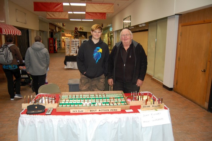 Music at the Mall - Don Johnson pens and seam rippers, with grandnson Ethan Lindquist
