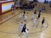Negaunee's Jason Waterman handles the ball in his team's 70-31 victory over the Hancock Bulldogs on Sunny 101.9.