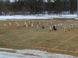 The Miners warming up before their anticipated match-up with the Grayling Vikings.