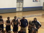 Negaunee huddles up during a timeout against West Iron County.