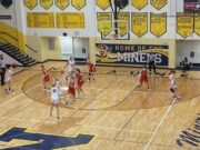 Lilly Nelson shoots a deep 3-pointer for the Miners. She had 14 points in Negaunee's 43-33 win.