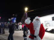 Santa poses with his handy work before meeting the kids
