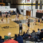 Negaunee Miners' Alyssa Hill driving on the right side of the paint.