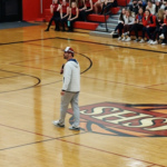 Gold Medalist for the 2022 Winter Olympics Nick Baumgartner talking at halftime
