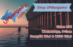 U.P. Bargains Newsletter for 07-28-26 UPBargains.com advertisement asking shoppers to Shop UP Bargains and listen LIVE on Wednesdays from 9-11am on SunnyFM 101.9 & WFXD 103.3 on top of a photo of someone paddle boarding on Lake Superior next to the Ore Dock