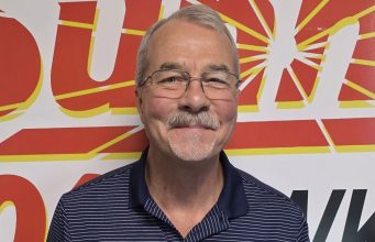 Project Keep Kids Warm Coordinator Dick Derby in the Sunny 101.9 studios after discussing the latest effort.