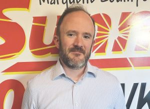 Marquette City Clerk Kyle Whitney in the Sunny 101.9 WKQS fm studios following interview on absentee and early voting in the city.